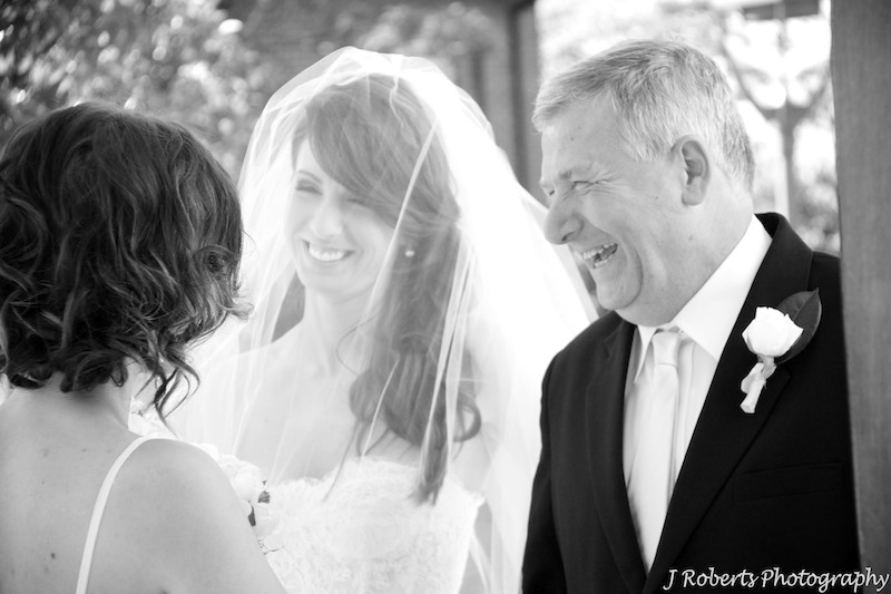 Bride laughing with her father outside the church - wedding photography sydney